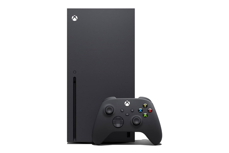 A black xbox series x next to a controller.